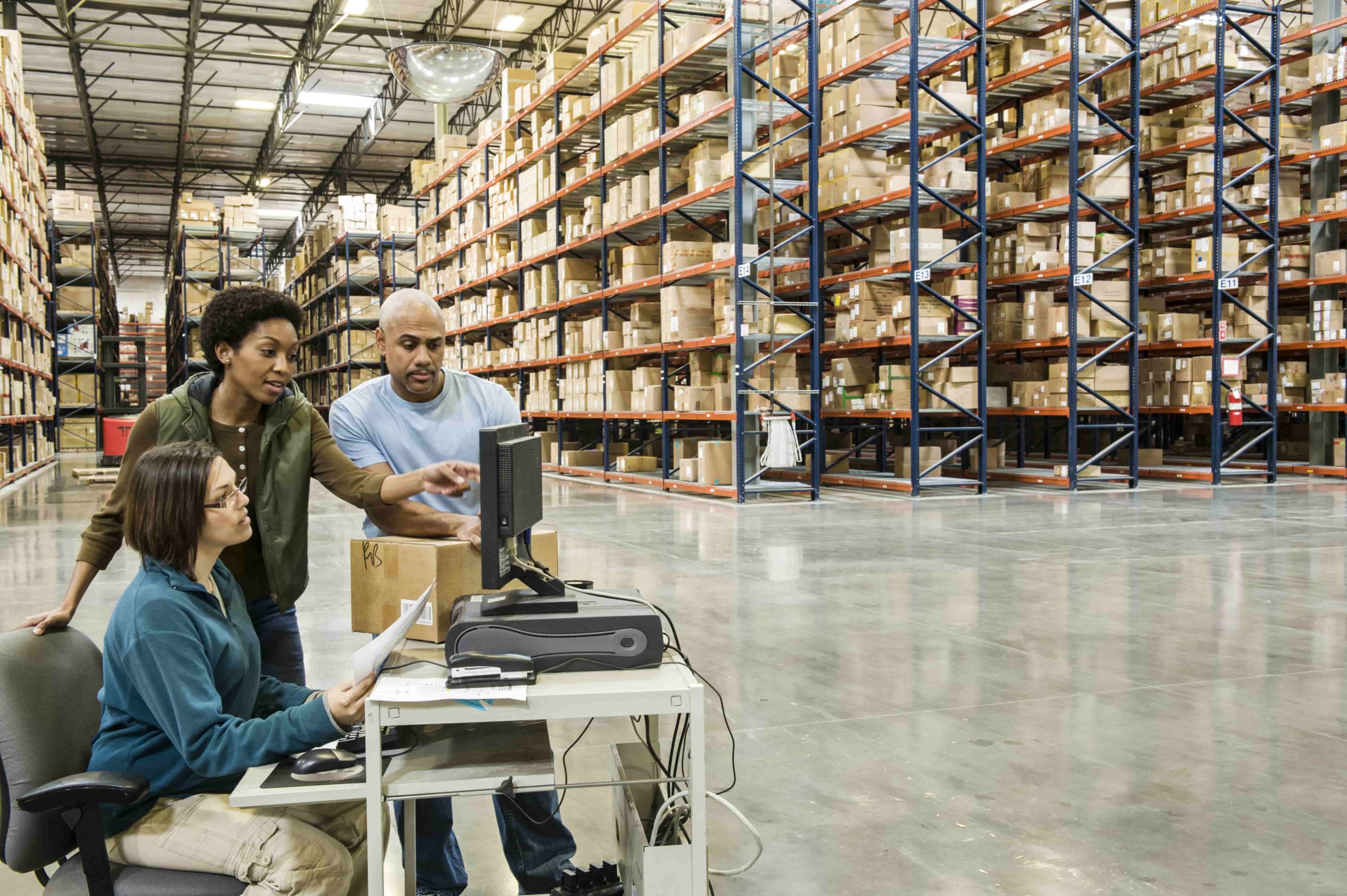 Warehouse workers checking inventory on a computer 2023 11 27 05 12 46 utc min